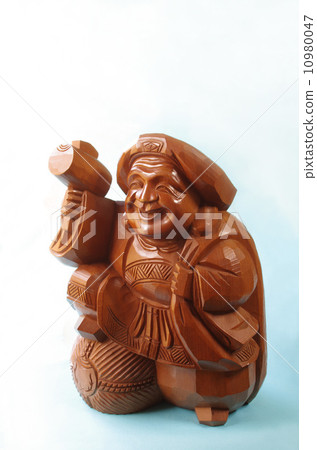 Stock Photo: the god of wealth, daikokuten, wooden