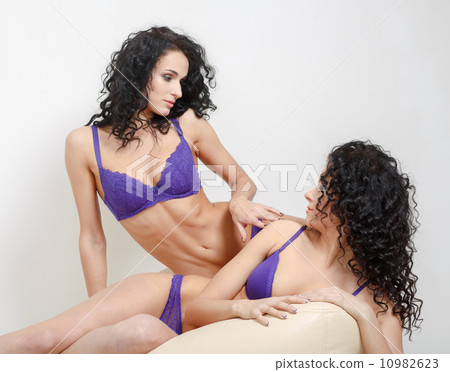 Lesbian play. Two beautiful girls in love foreplay 10982623