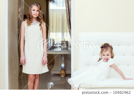 Two beautiful sisters posing in restaurant Two beautiful sisters posing in restaurant 10982962