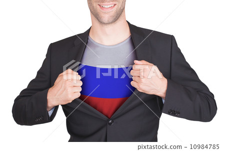 Businessman opening suit to reveal shirt with flag 10984785