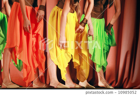 Bright fragment of modern dance show with colorful girls waved skirt Bright fragment of modern dance show with colorful girls waved skirt 10985052