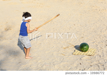 Boy breaking watermelon 10986772