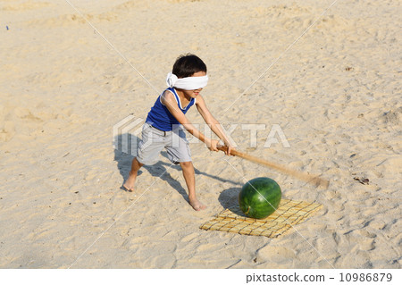 Boy breaking watermelon Boy breaking watermelon 10986879