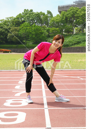 Women exercising at the stadium Women exercising at the stadium 10987058