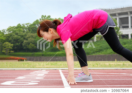 Women exercising at the stadium 10987064