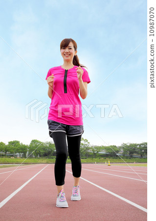 Women exercising at the stadium 10987070