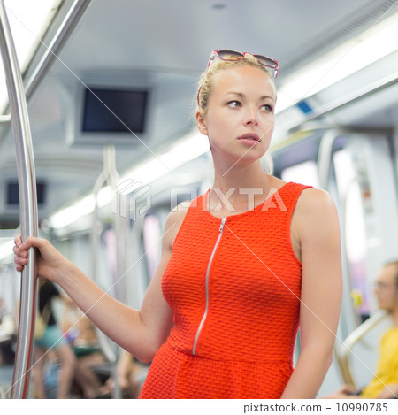 Lady traveling by metro. Lady traveling by metro. 10990785