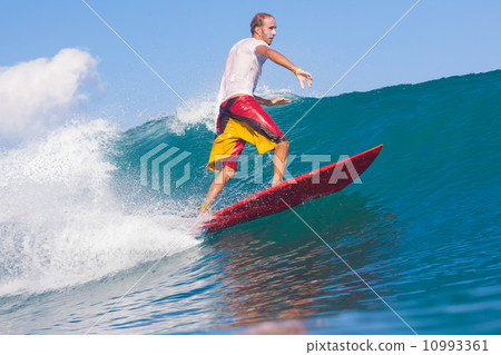 Surfing a wave. 10993361
