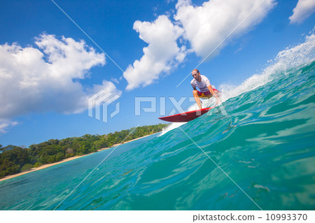 Surfing a wave. 10993370