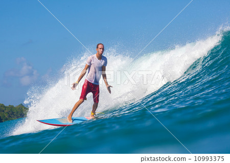 Surfing a wave. 10993375