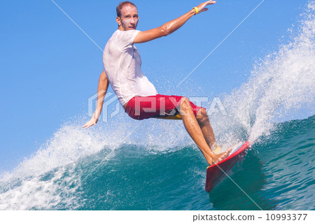Surfing a wave. 10993377