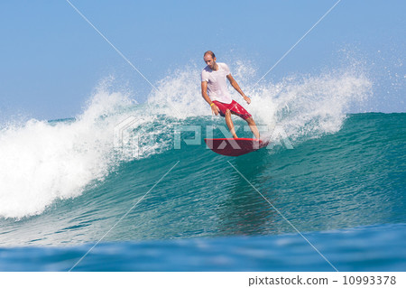 Surfing a wave. 10993378