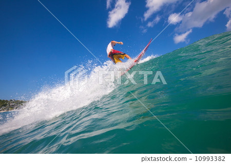 Surfing a wave. 10993382