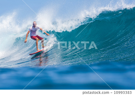 Surfing a wave. 10993383