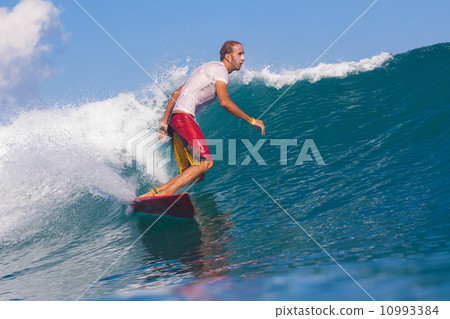 Surfing a wave. 10993384