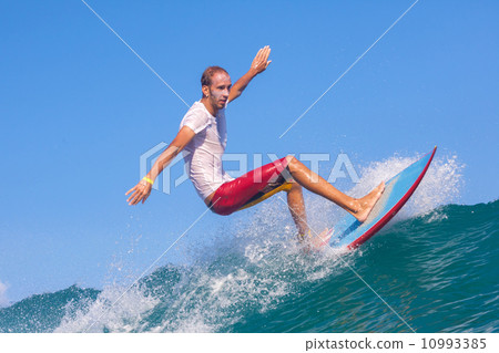 Surfing a wave. 10993385