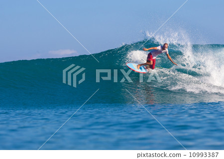 Surfing a wave. 10993387