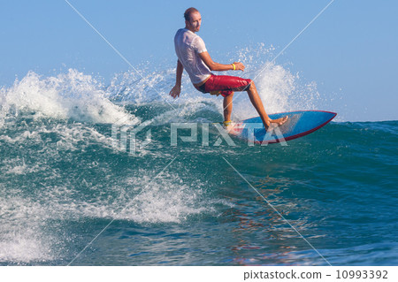 Surfing a wave. 10993392