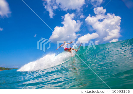 Surfing a wave. 10993396