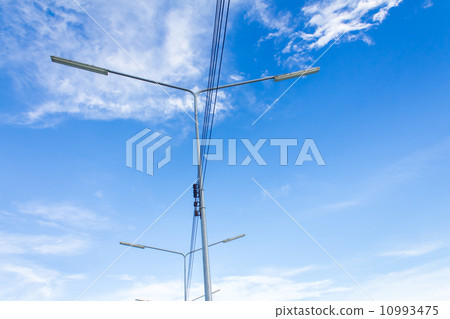Electric lighting system tower on blue sky background Electric lighting system tower on blue sky background 10993475