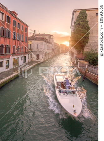 Gondola with gondolier in Venice, Italy 10993659