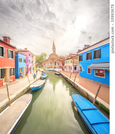 Murano and Burano island, street with glass store 10993678