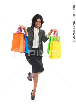 indian woman jumping in joy during shopping spree indian woman jumping in joy during shopping spree 10994980