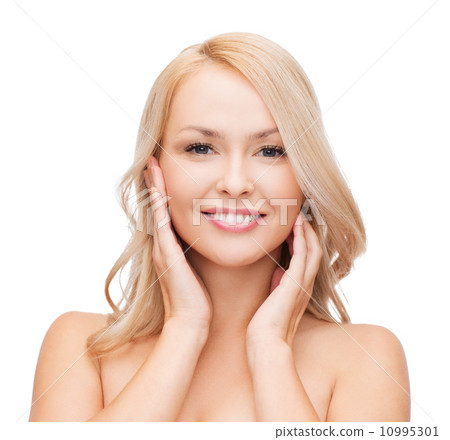 woman touching her face skin woman touching her face skin 10995301