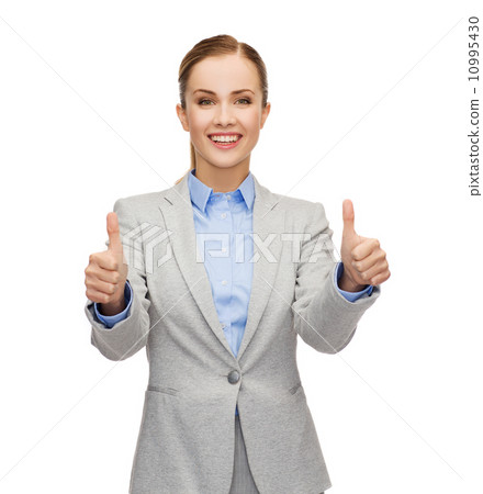 smiling businesswoman showing thumbs up 10995430