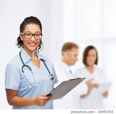 smiling female african american doctor or nurse 10995783
