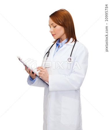 smiling female doctor with clipboard 10995784