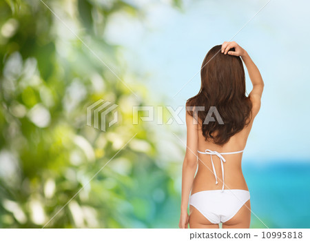 beutiful woman posing in white bikini 10995818