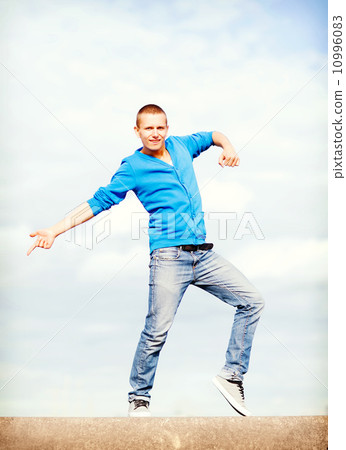 handsome boy making dance move handsome boy making dance move 10996083