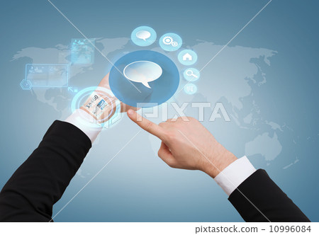 businessman pointing to virtual watch at his hand 10996084
