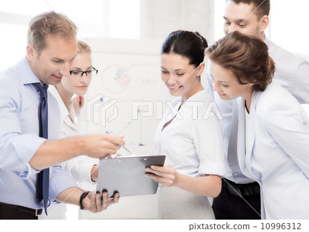 business team discussing something in office business team discussing something in office 10996312