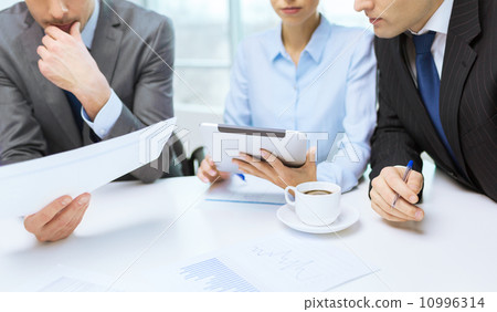 business team with graph, tablet pc and coffee business team with graph, tablet pc and coffee 10996314
