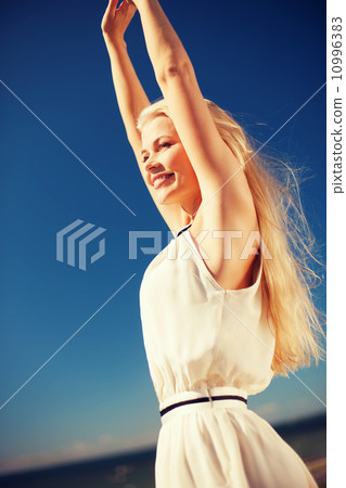 beautiful woman enjoying summer outdoors beautiful woman enjoying summer outdoors 10996383