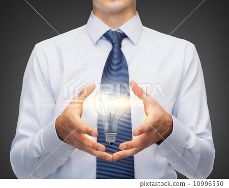 buisnessman holding something in his hands 10996550