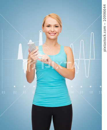 sporty woman with smartphone 10996644