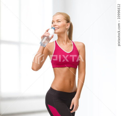 smiling woman with bottle of water 10996812