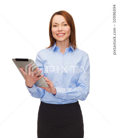 smiling woman looking at tablet pc smiling woman looking at tablet pc 10996894