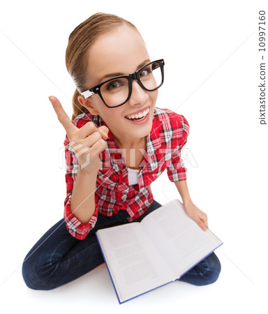 smiling teenage girl in eyeglasses reading book 10997160