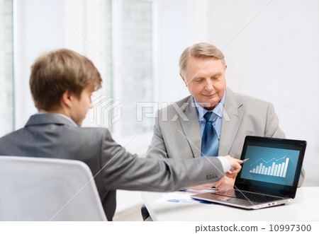 older man and young man with laptop computer older man and young man with laptop computer 10997300