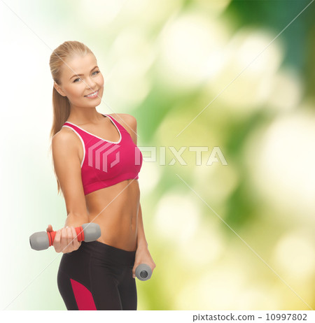 young sporty woman with light dumbbells young sporty woman with light dumbbells 10997802
