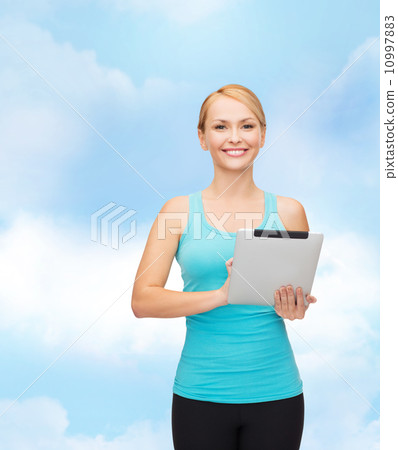 sporty woman with tablet pc 10997883