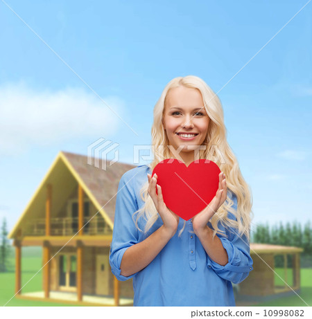 smiling woman with red heart 10998082