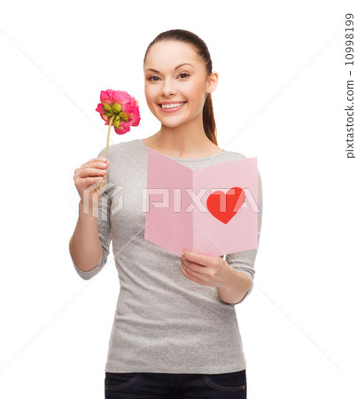 smiling woman with postcard and flower 10998199