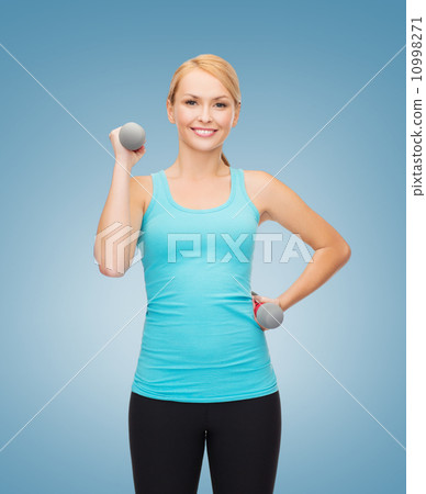 young sporty woman with light dumbbells young sporty woman with light dumbbells 10998271
