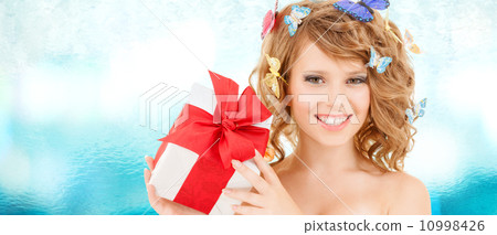 teenager with butterflies in hair showing present 10998426