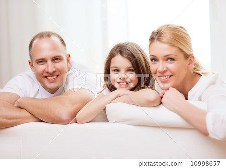 smiling parents and little girl at home smiling parents and little girl at home 10998657